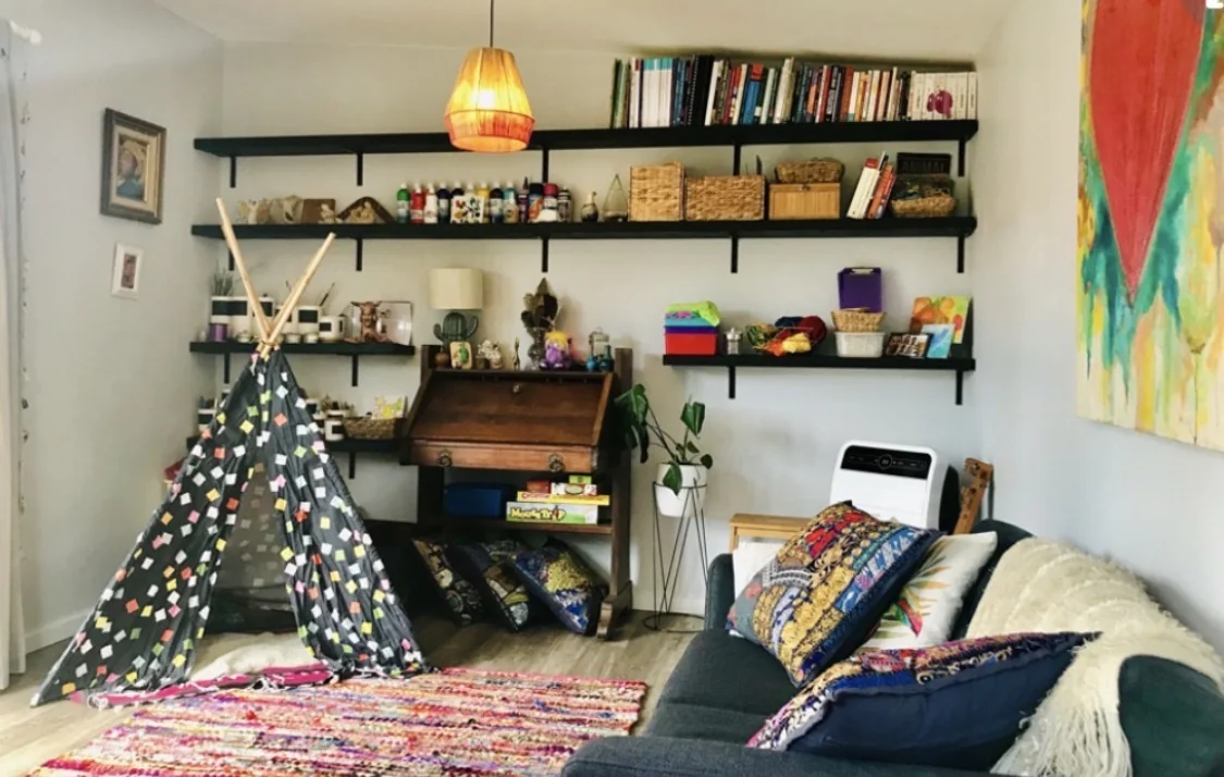 Creative Hearts room with a play tent, art materials and seating